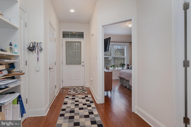 corridor featuring dark hardwood / wood-style flooring