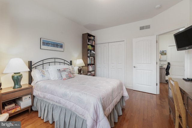 bedroom featuring a closet and wood-type flooring