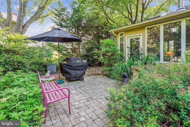 view of patio featuring a grill