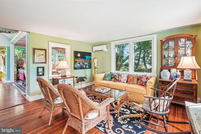 living room with dark hardwood / wood-style floors and a wall mounted air conditioner