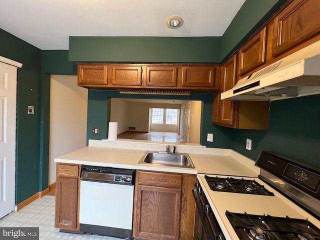 kitchen featuring black gas range, dishwasher, and sink