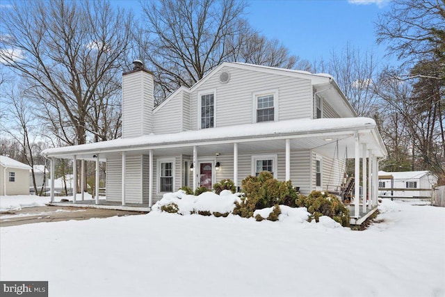 country-style home featuring covered porch