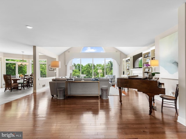 living room featuring dark hardwood / wood-style floors and vaulted ceiling