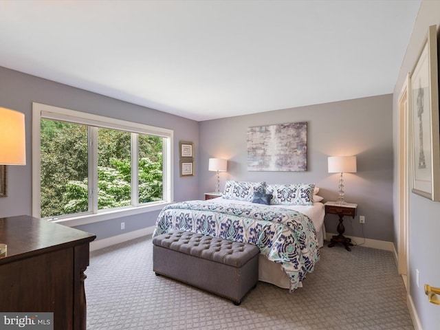 bedroom with light colored carpet