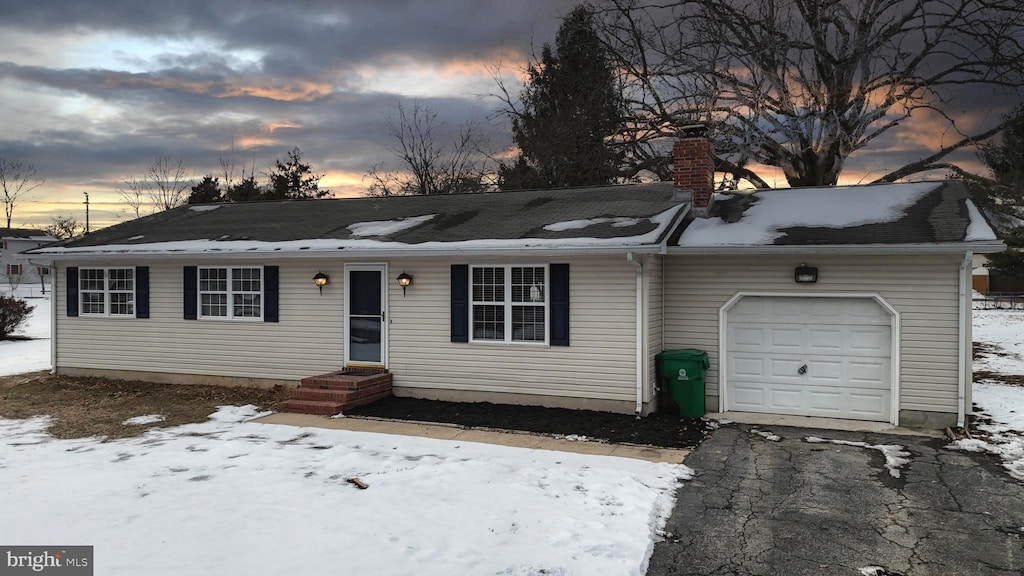 single story home featuring a garage