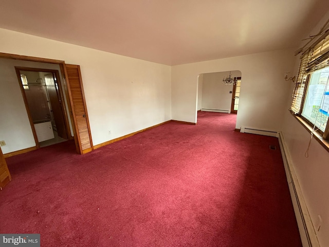 unfurnished room featuring carpet and a baseboard heating unit