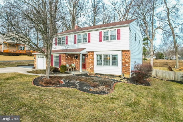 view of front of property with a garage and a front yard