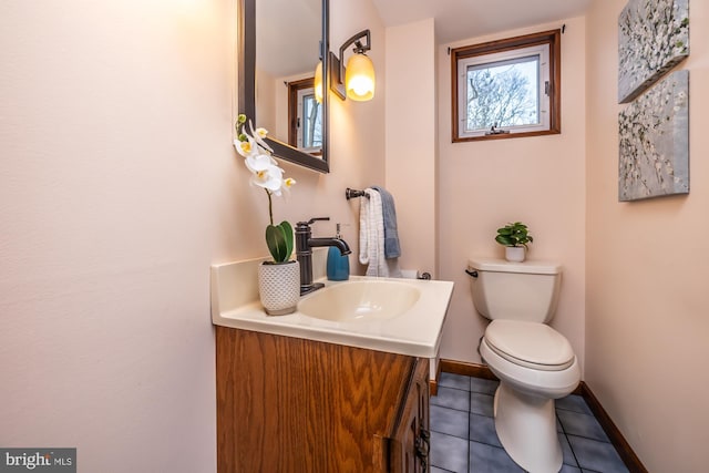 bathroom with vanity, tile patterned floors, and toilet