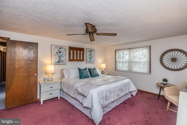 bedroom with ceiling fan, carpet flooring, and a textured ceiling