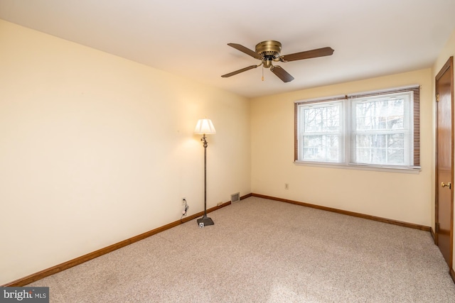 carpeted empty room with ceiling fan