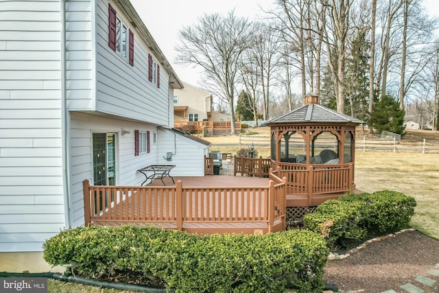 deck featuring a yard and a gazebo