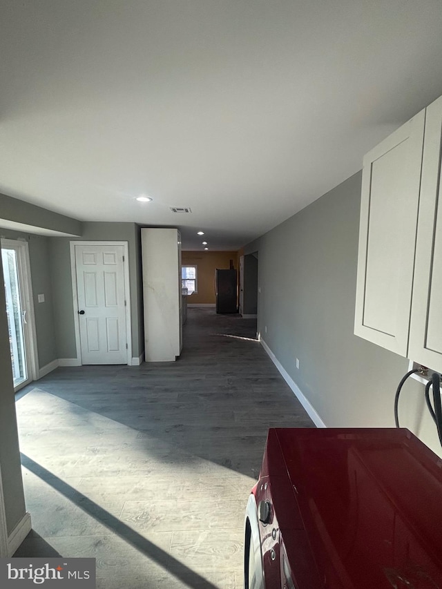 living room with a wealth of natural light and hardwood / wood-style flooring