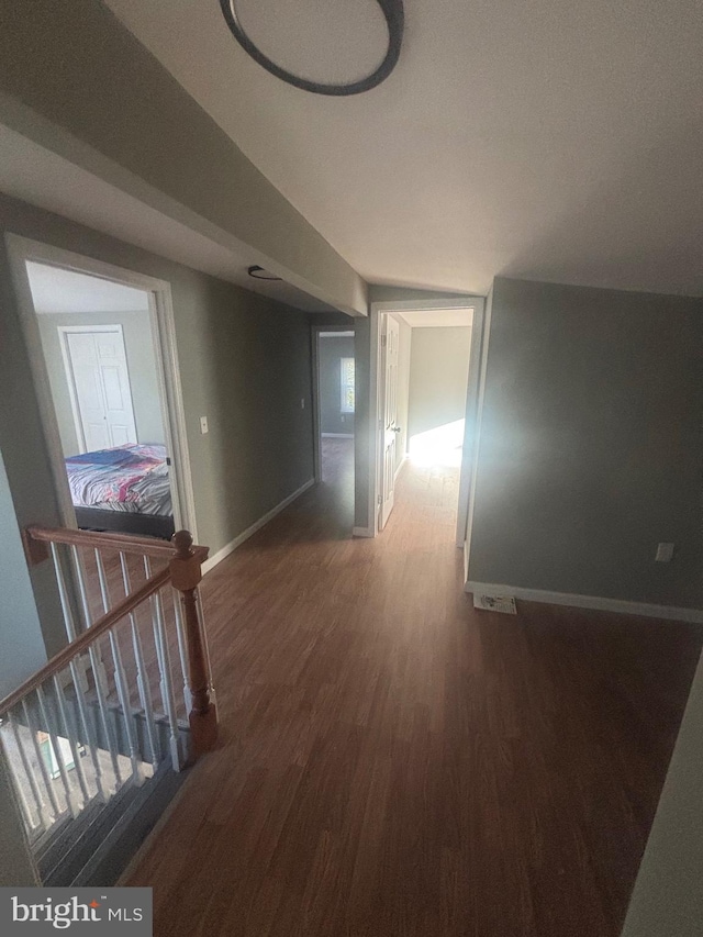 corridor featuring dark hardwood / wood-style floors