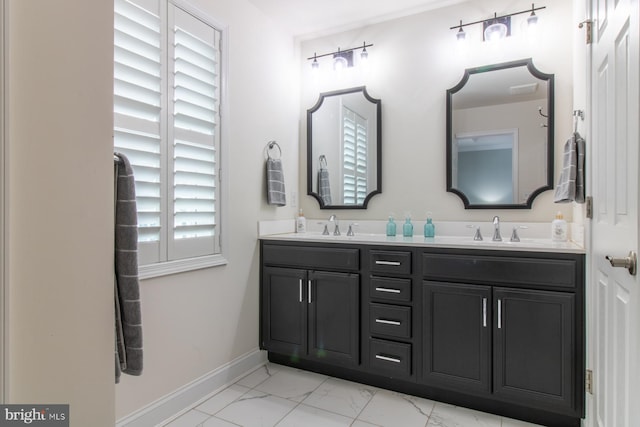 bathroom with vanity and plenty of natural light