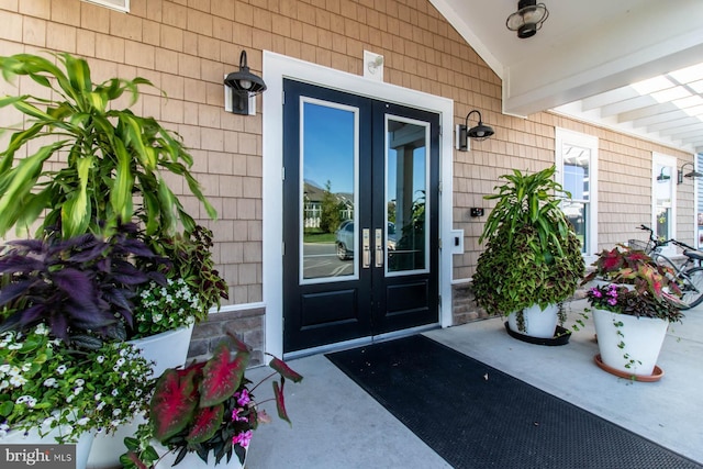 doorway to property featuring covered porch