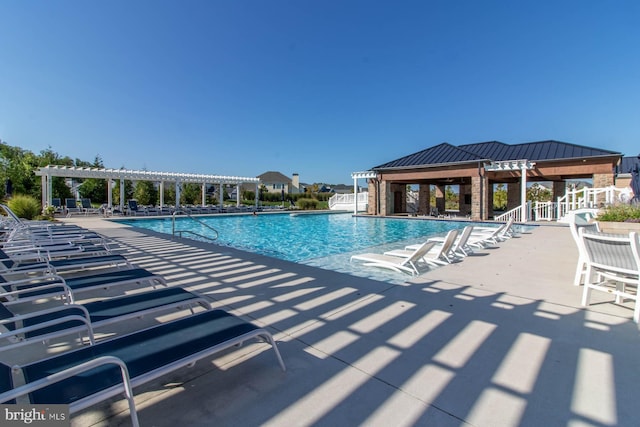 view of pool with a patio area and a pergola