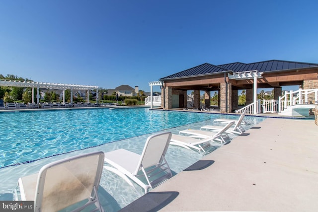 view of swimming pool with a pergola and a patio area