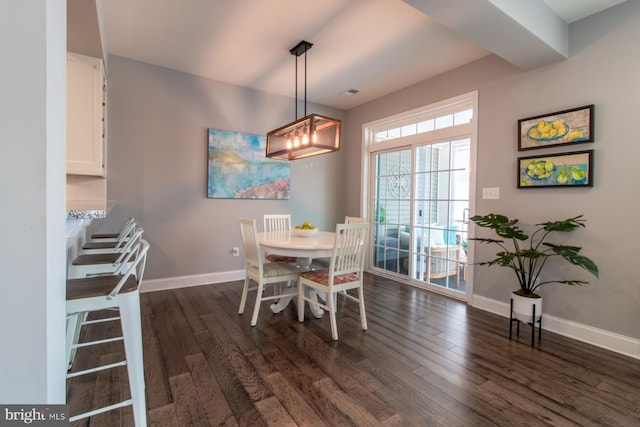 dining area featuring dark hardwood / wood-style flooring