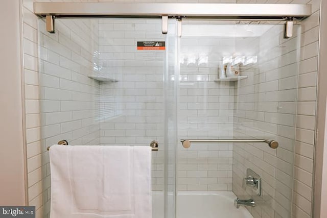 bathroom featuring enclosed tub / shower combo