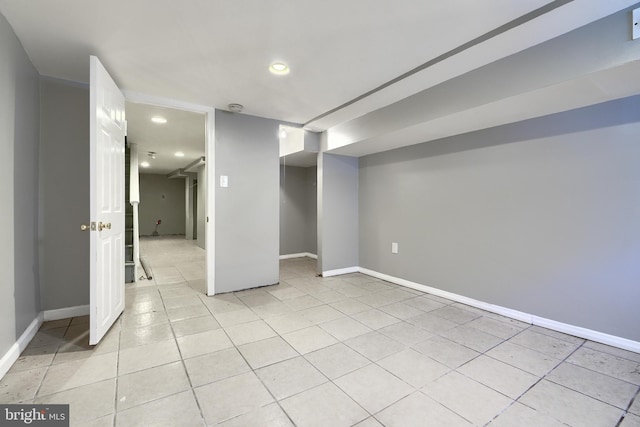 basement featuring light tile patterned flooring