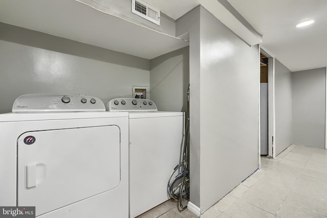 washroom featuring washer and dryer