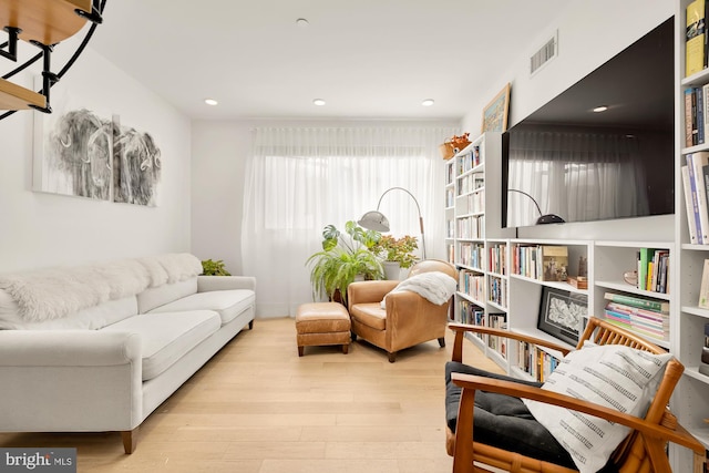 sitting room with light hardwood / wood-style floors