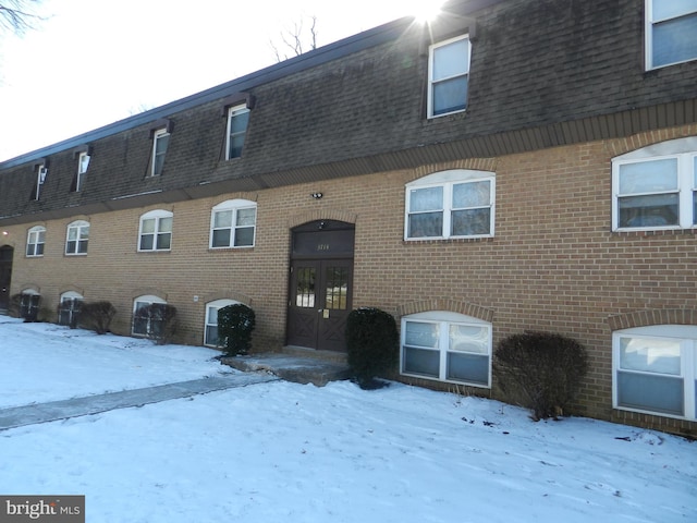 view of snow covered property