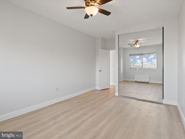 spare room featuring ceiling fan and light wood-type flooring