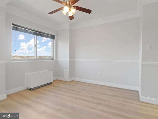 empty room featuring crown molding, ceiling fan, and light wood-type flooring