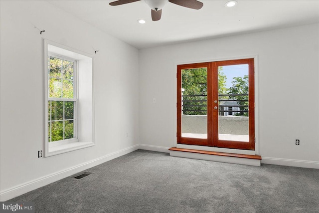 1631 U St SE, Washington, DC 20020 - empty room featuring french doors, healthy amount of natural light, carpet floors, a ceiling fan, and recessed lighting