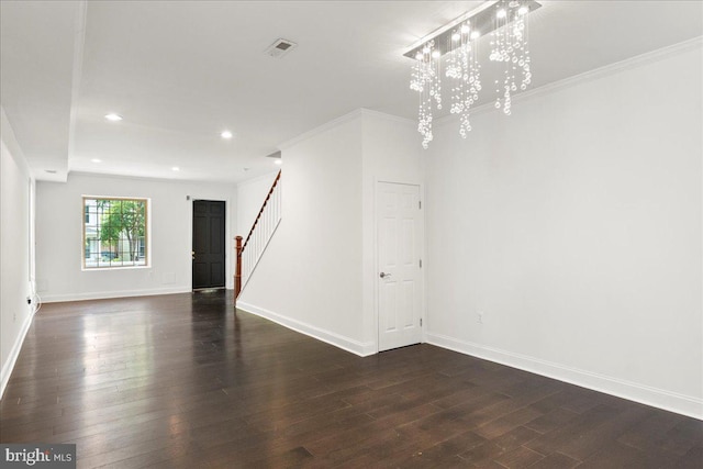 1631 U St SE, Washington, DC 20020 - unfurnished living room featuring stairs, dark wood-type flooring, recessed lighting, a chandelier, and ornamental molding