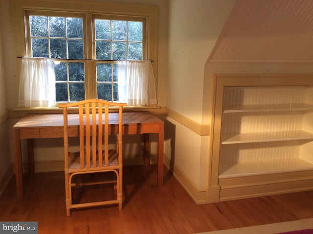 unfurnished dining area featuring hardwood / wood-style flooring