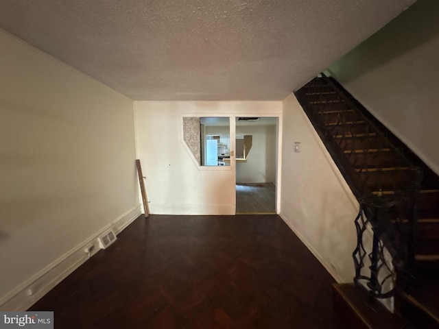 corridor with a textured ceiling