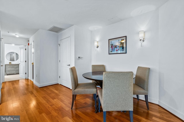 dining area featuring hardwood / wood-style flooring