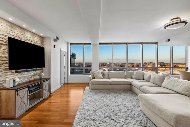 living room with plenty of natural light and wood-type flooring