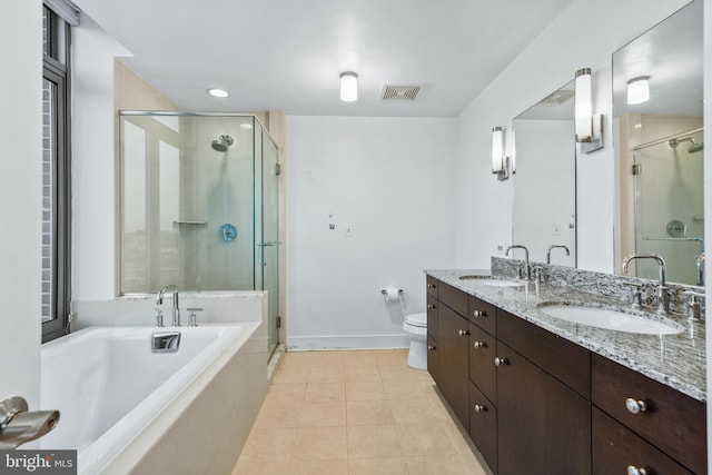 full bathroom featuring toilet, tile patterned flooring, shower with separate bathtub, and vanity