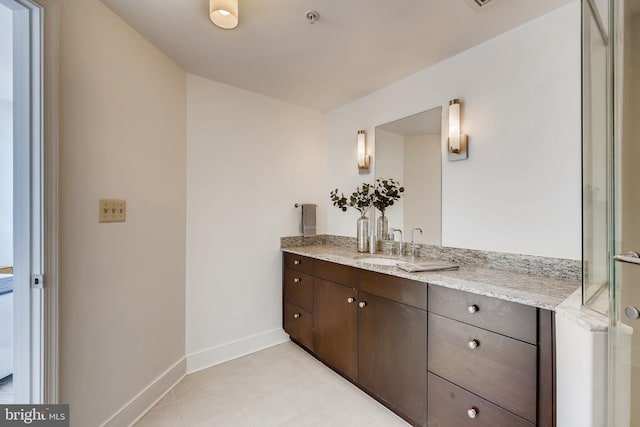 bathroom with vanity and tile patterned flooring