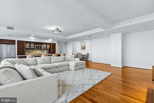 living room with light hardwood / wood-style floors