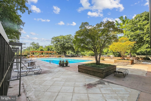 view of pool featuring a pergola and a patio area