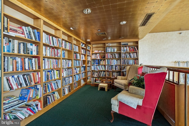 living area with built in shelves and carpet floors