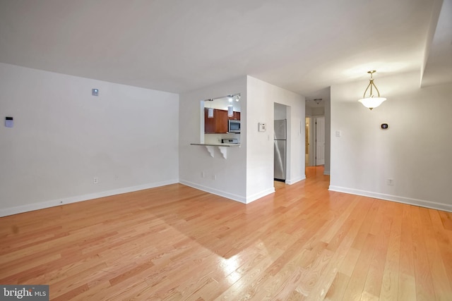 unfurnished living room featuring light wood-type flooring