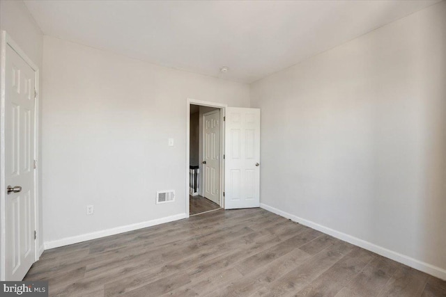 unfurnished bedroom featuring hardwood / wood-style floors