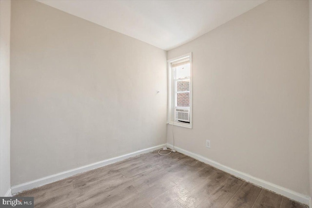 unfurnished room with light wood-type flooring