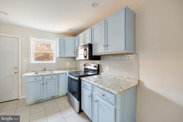 kitchen featuring decorative backsplash, sink, electric range, and light tile patterned floors