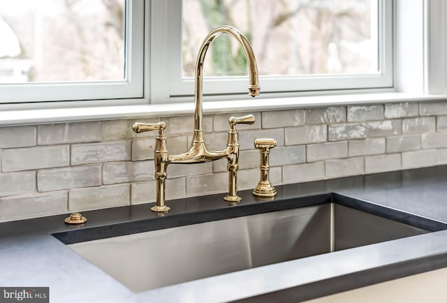 interior details with backsplash and sink