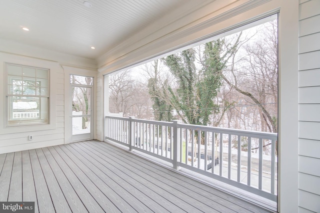 unfurnished sunroom featuring a wealth of natural light