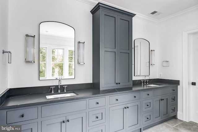 bathroom with crown molding and vanity