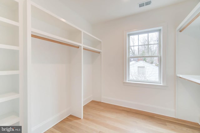 walk in closet featuring light wood-type flooring