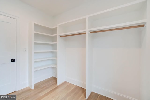 walk in closet featuring hardwood / wood-style floors