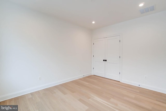 unfurnished room featuring light hardwood / wood-style floors